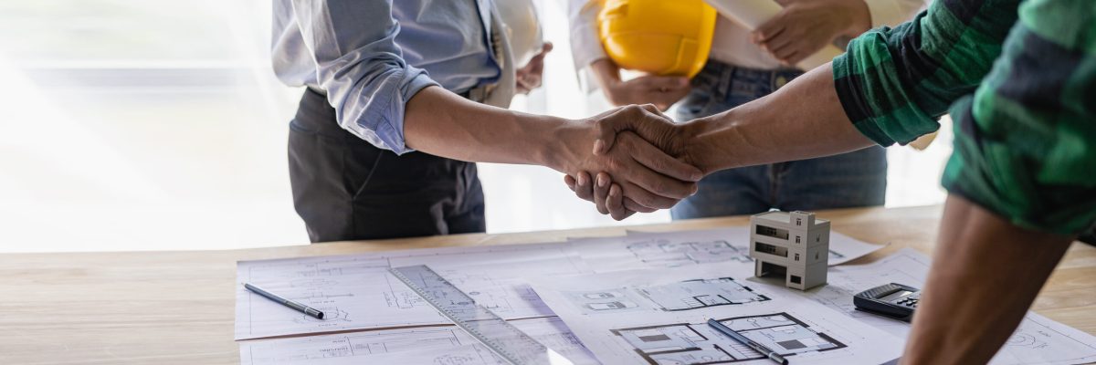 Yellow hard hat on table and house design print design with cons Yellow hard hat on table and house design print design with cons